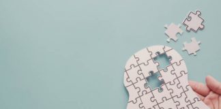 Mental Health: 3 Ways To Know When Someone Is Silently Suffering Hands holding brain with puzzle paper