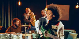 9 Useful, Easy To Learn Skills That Will Help You Impress People Mixed race woman singing and playing