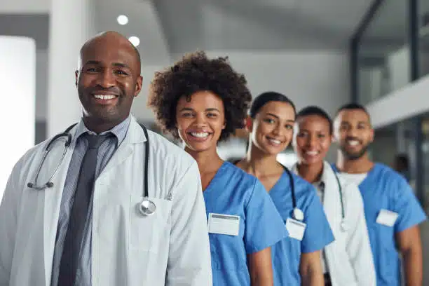 Portrait of a group of medical practitioners standing in a line in a hospital