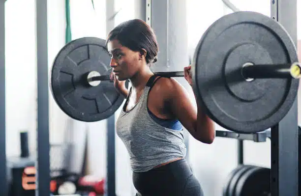 a woman's workout with barbell, total
