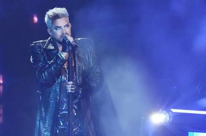 Fans of American Idol'scream' when a competitor returns as a guest mentor after pleading with the show to make substantial changes. https://www.billboard.com/culture/tv-film/adam-lambert-performance-american-idol-cover-i-cant-stand-the-rain-1235318876/