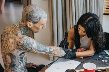 Kourtney Kardashian Cozies Up to Travis Barker While He Gets Tattoo