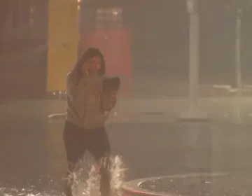 women caught on flooded streets