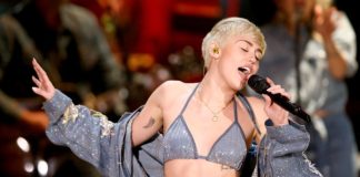 2014 Concert Chaos: Miley Cyrus Stops Mid-Song to Film Fan Fight "Miley Cyrus concert fight recording "