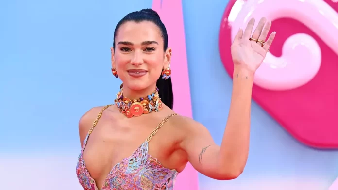 Dua Lipa surprises old primary school