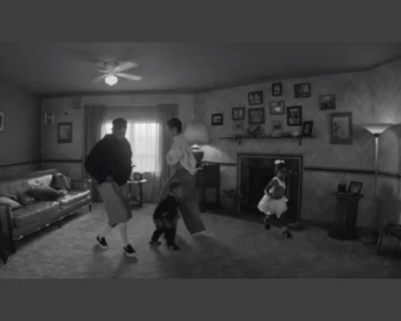 Kendrick’s fiancée, Whitney Alford, and their two children are shown dancing in a cozy living room