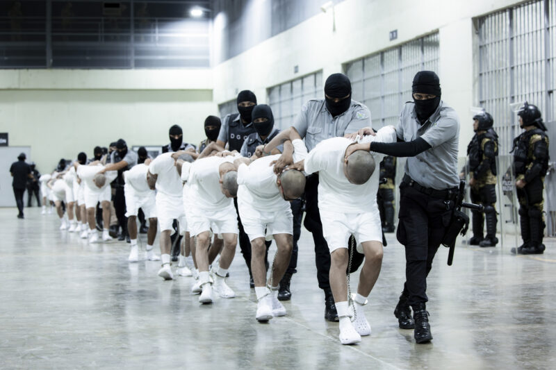 Prison guards escort alleged Venezuelan gang members
