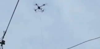Man Trapped on Roof in China Floods Dramatically Saved by Powerful Drone china flood drone rescue man on roof