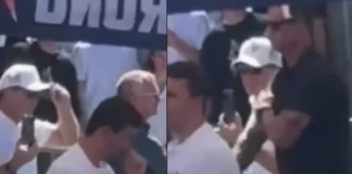 Suspicious Gestures Before Charlie Kirk Shooting Spark Debate 2 men standing behind Charlie Kirk look like they gave hand signals