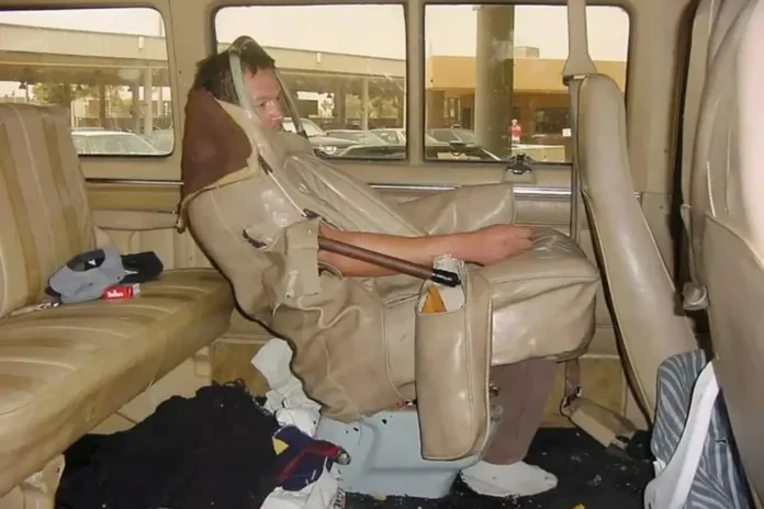 man sewn into car seat