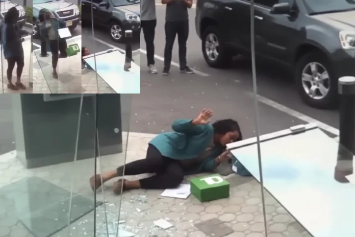 bank door collapses on woman