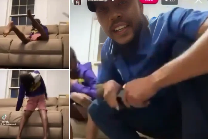 father spanks son belt