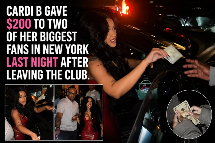Cardi B hands cash