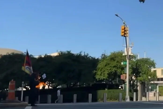 UN building NYC protester fire